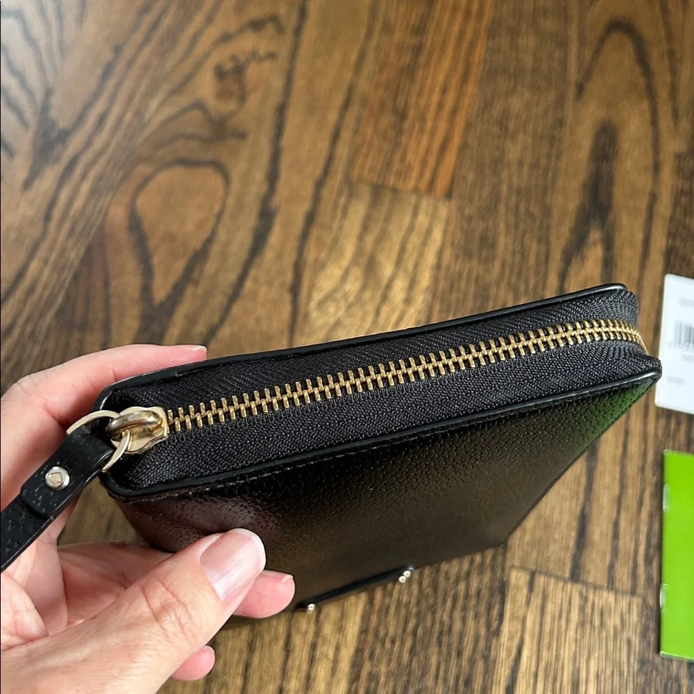 Black leather Kate Spade Wellesley zip around personal organizer/planner